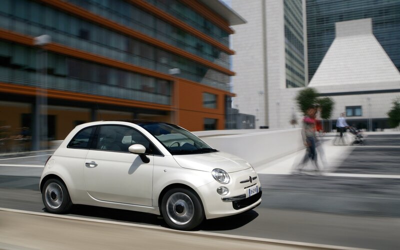 White Fiat 500 in city