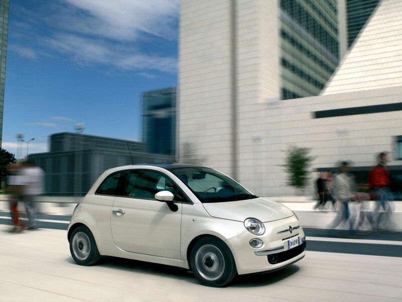 White Fiat 500 in city