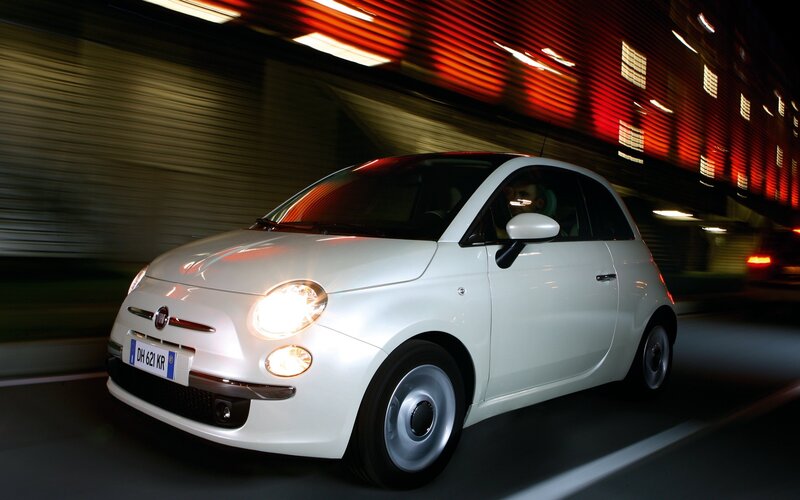 White Fiat 500 in motion