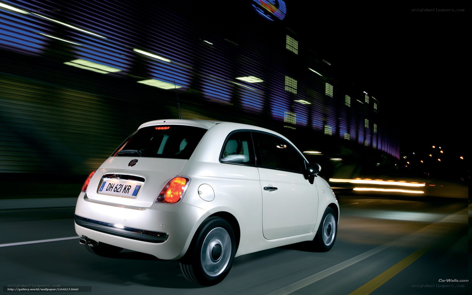 white fiat 500 in motion