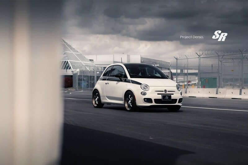 White Fiat 500 on a racetrack