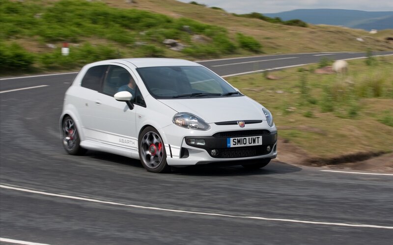 white fiat abarth on road