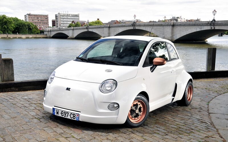 White Fiat car by the river