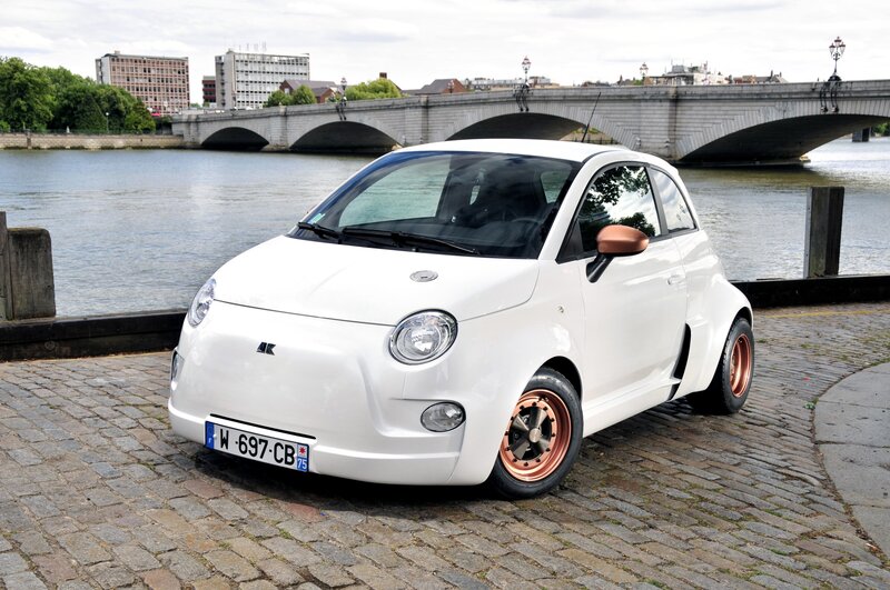 White Fiat car by the river
