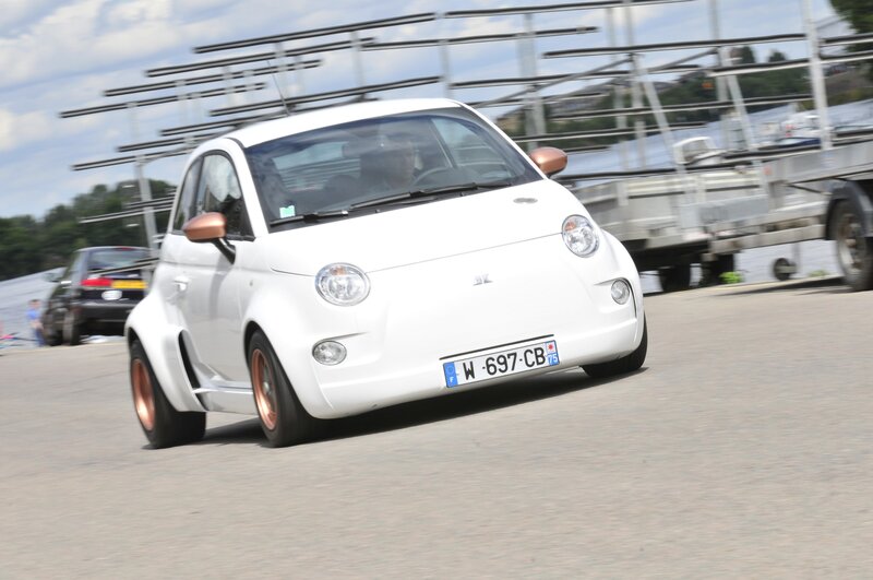 white fiat car in motion