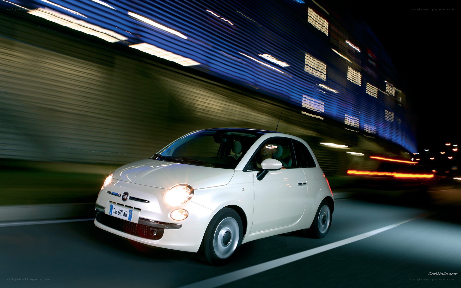 white fiat driving at night