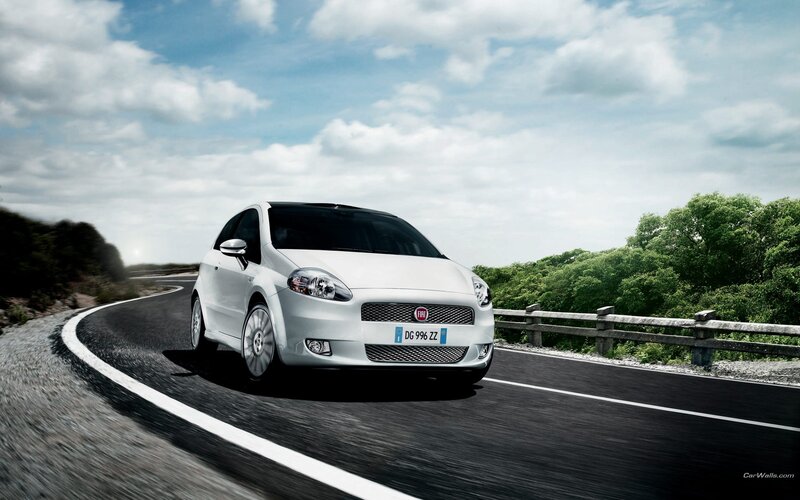 White Fiat on a winding road