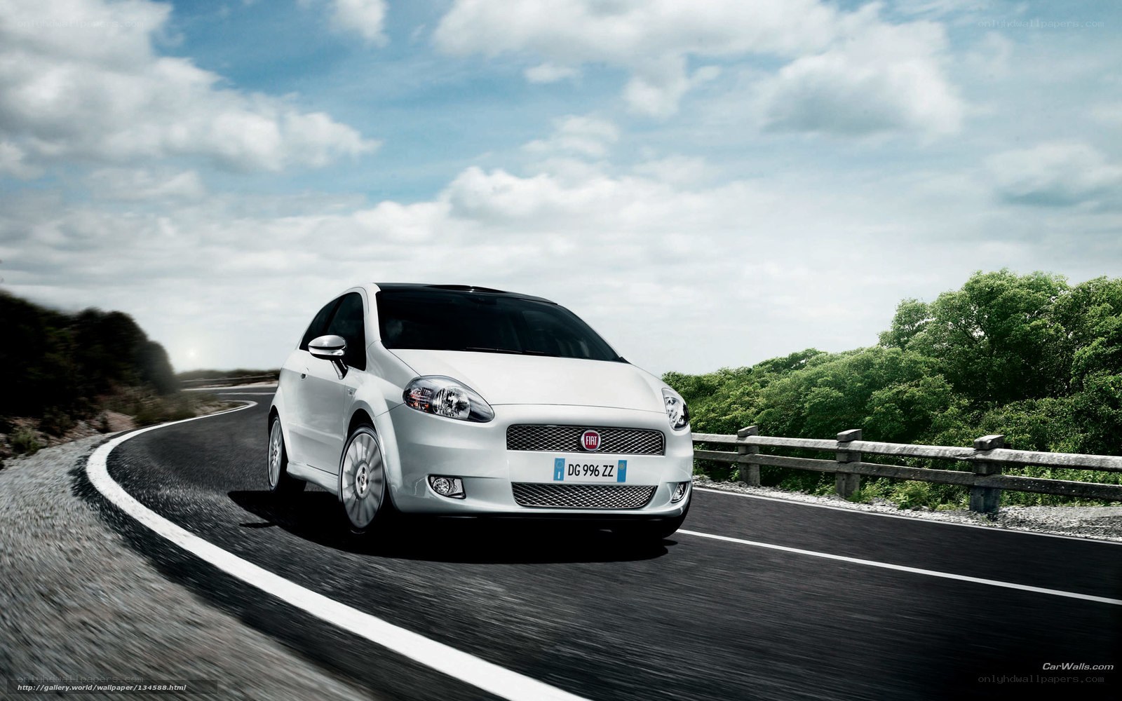 White Fiat on a winding road
