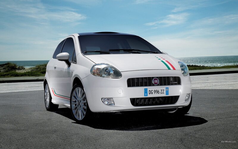 White Fiat Punto by the sea