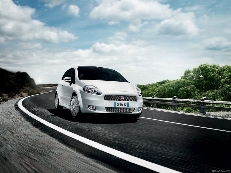 White Fiat Punto driving on a road