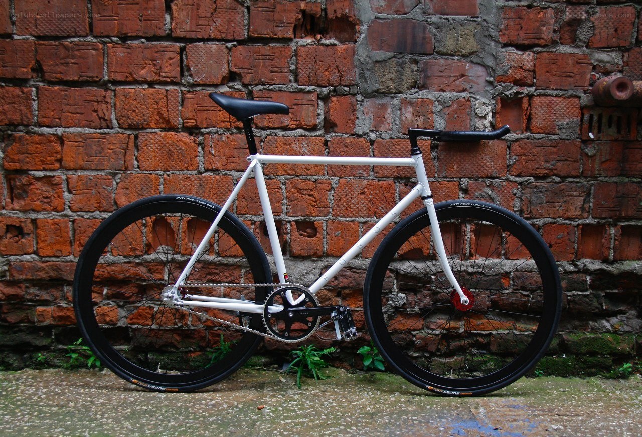 white fixed-gear bicycle