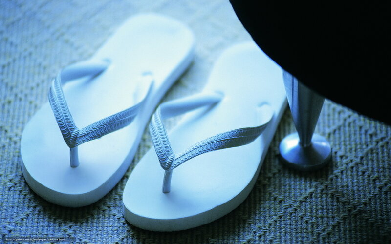 white flip flops on carpet