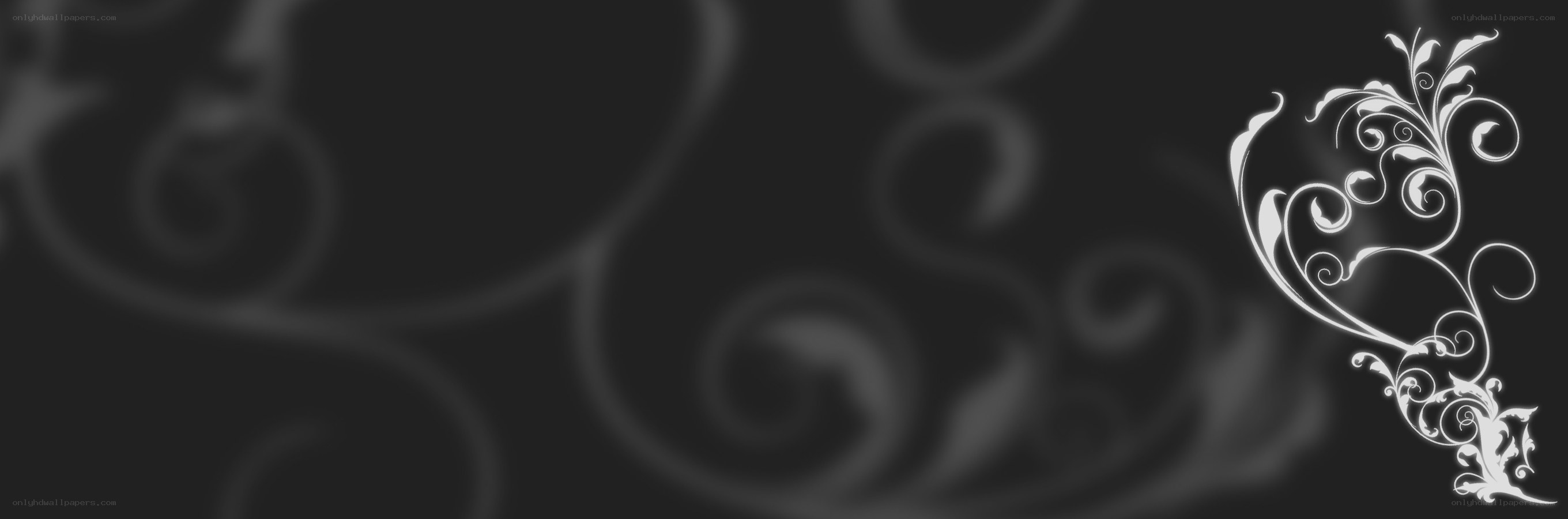 white floral design on dark background