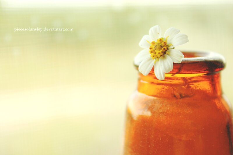 White Flower in Amber Bottle