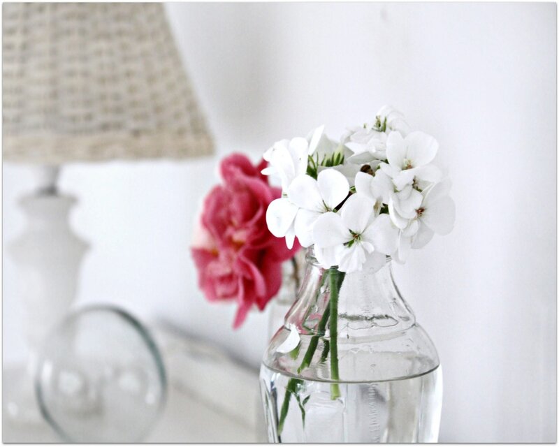 White flowers in a glass bottle