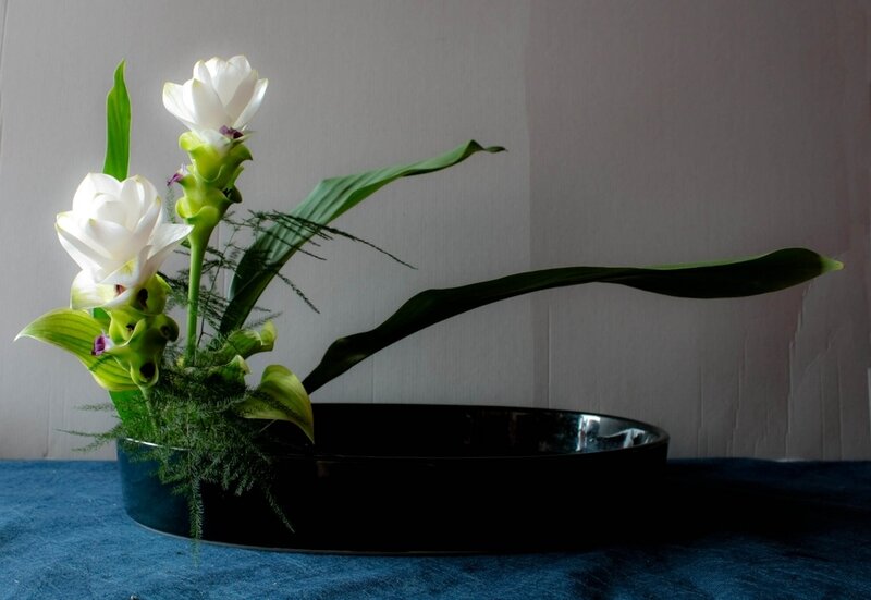 White Flowers in Black Bowl