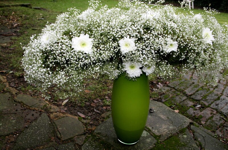 White flowers in green vase
