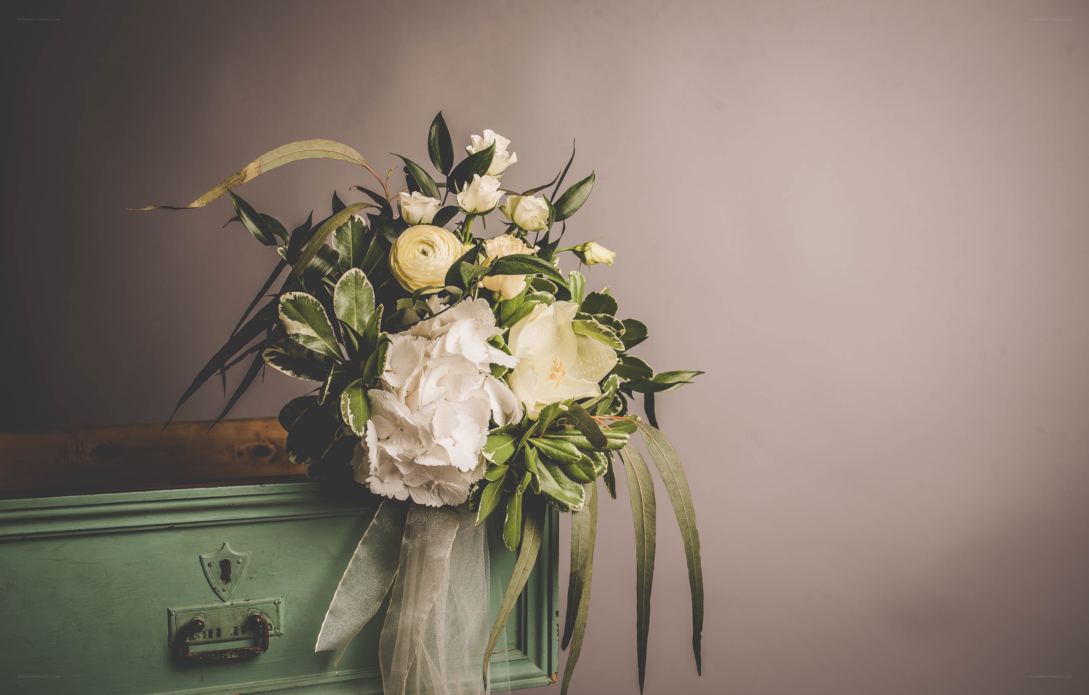 White flowers on green chest