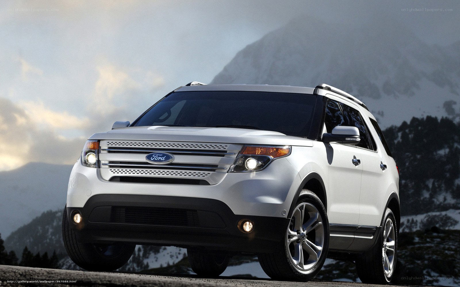 White Ford Explorer in mountains