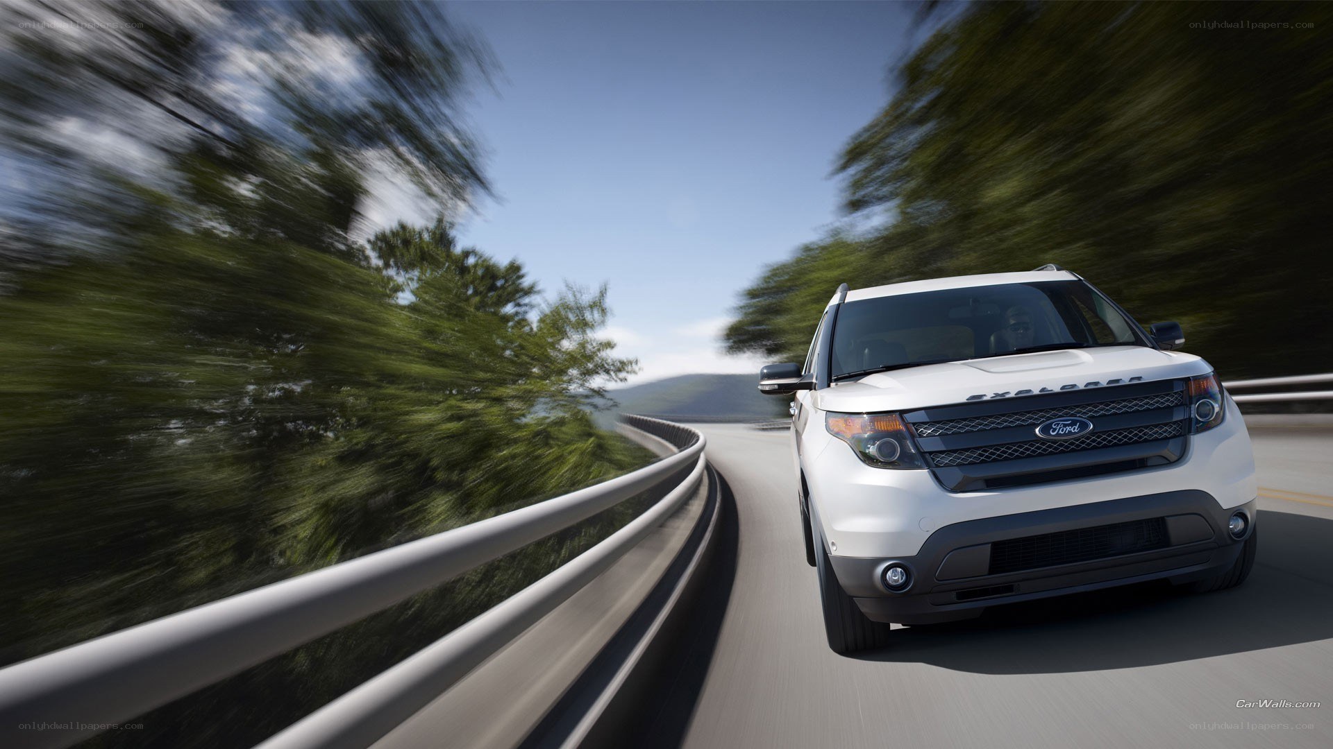 White Ford Explorer on winding road