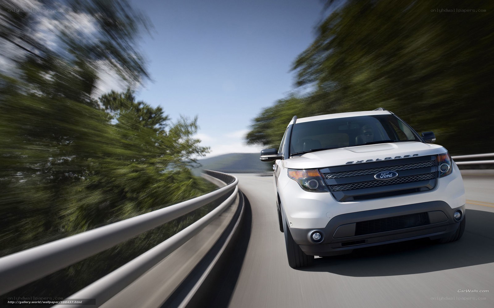 White Ford Explorer on winding road