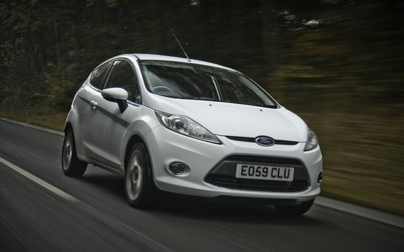 White Ford Fiesta in motion