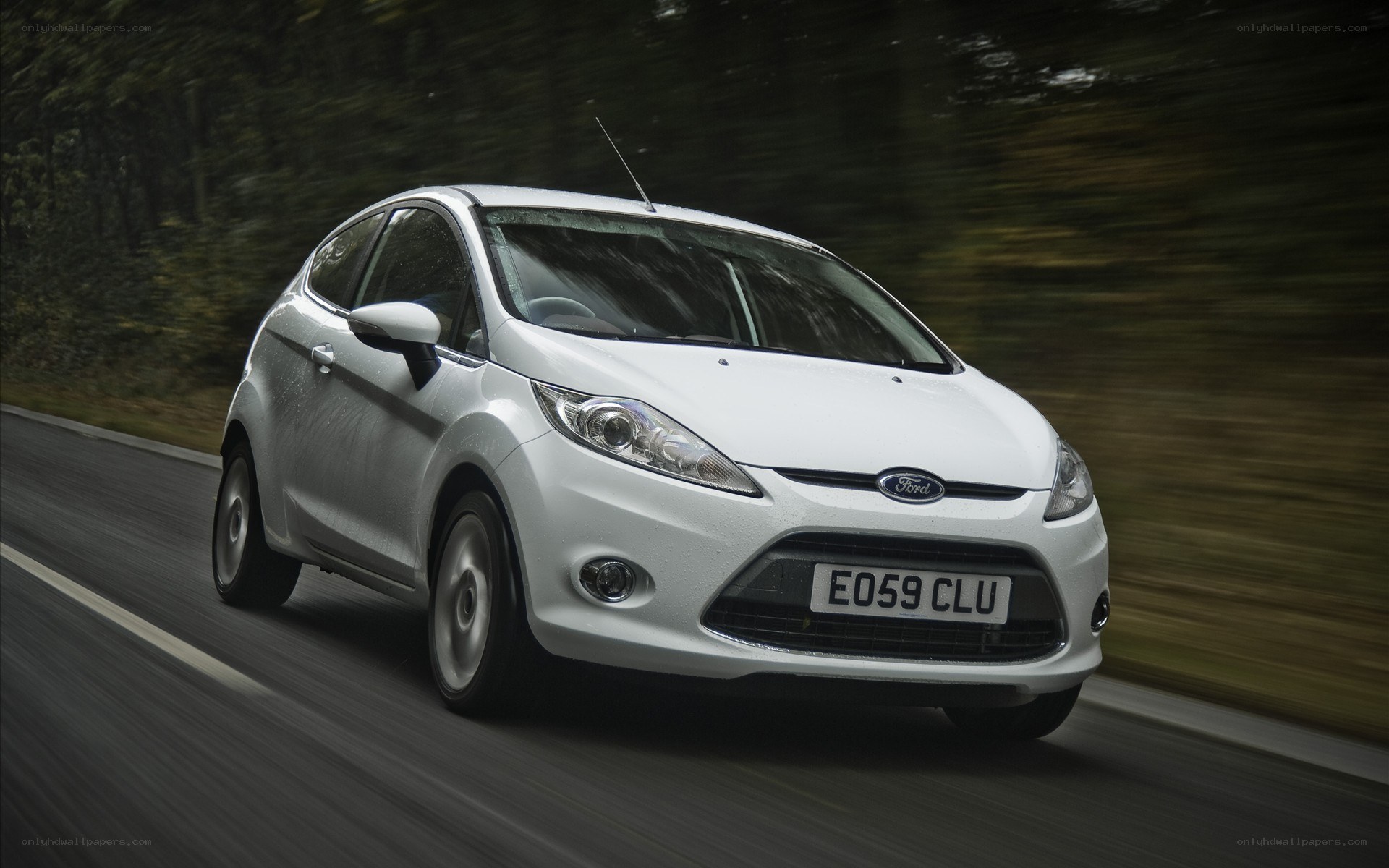White Ford Fiesta in motion