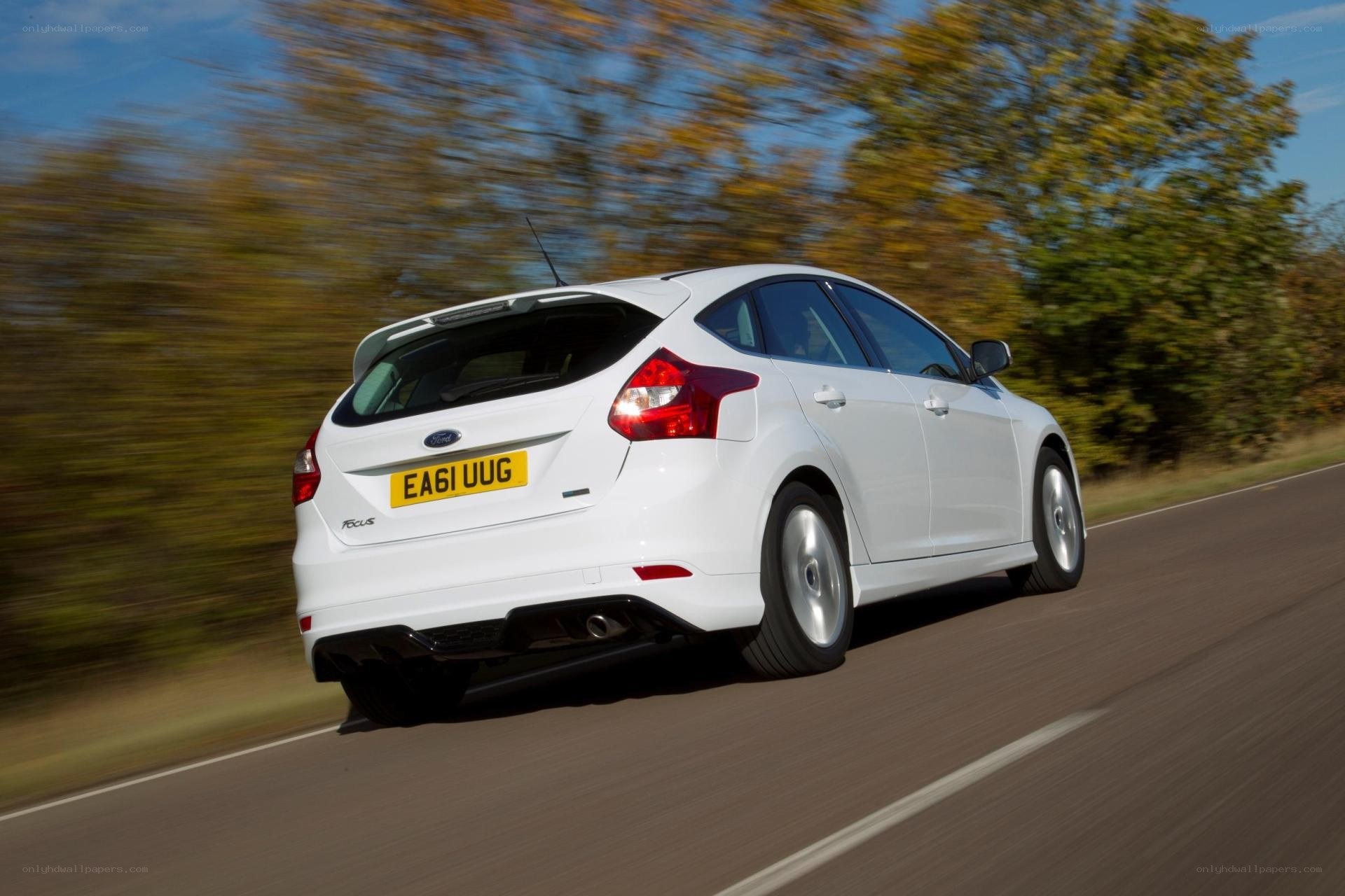 white ford focus driving on road
