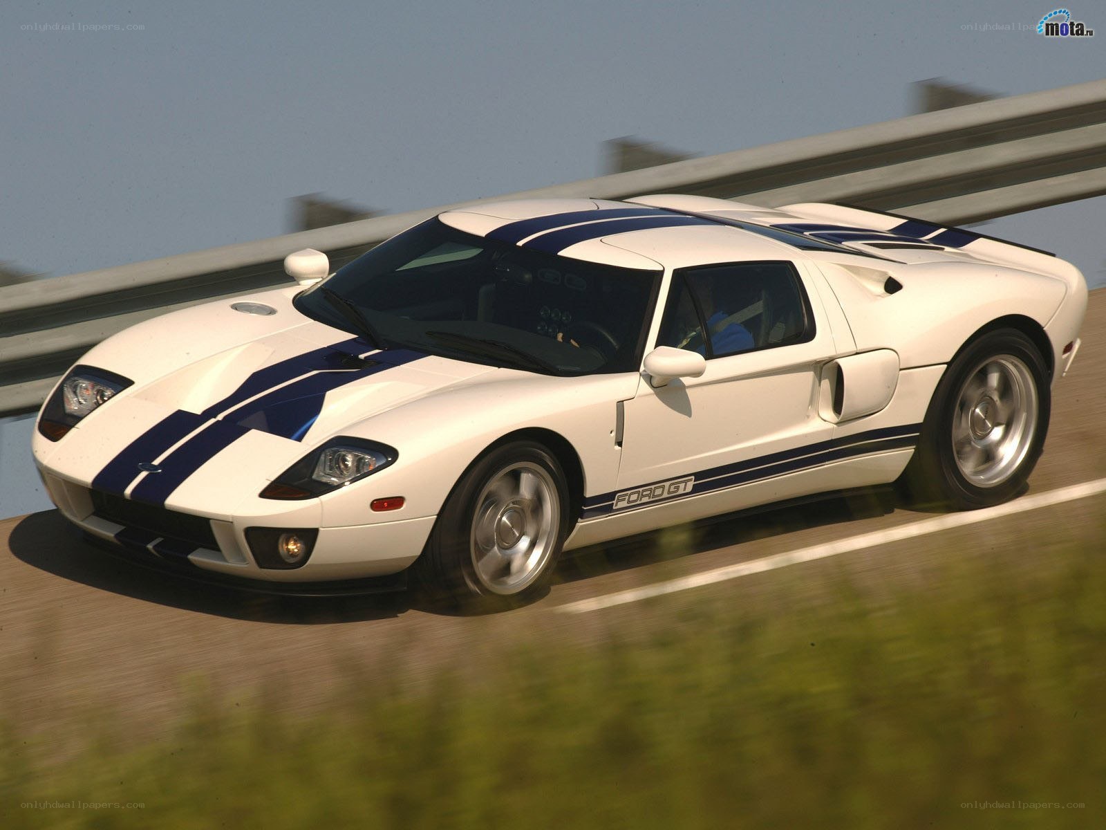White Ford GT on a racetrack