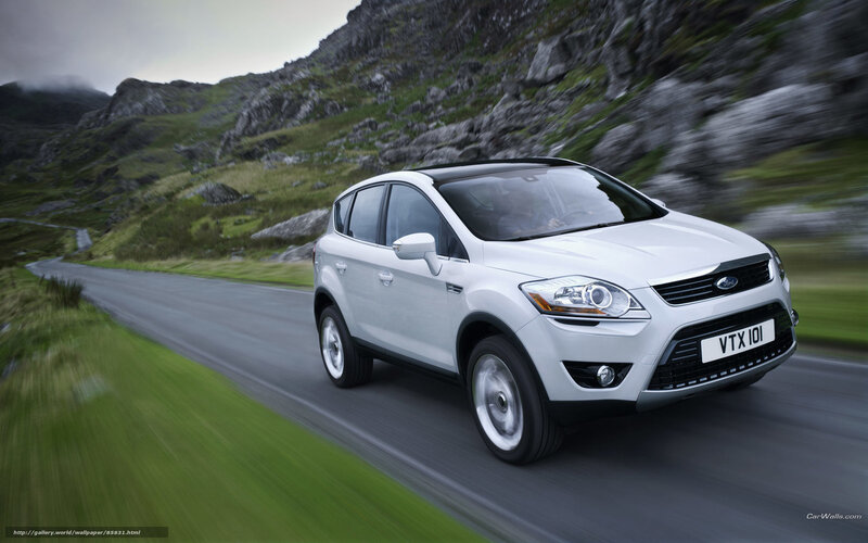 white ford kuga driving on mountain road
