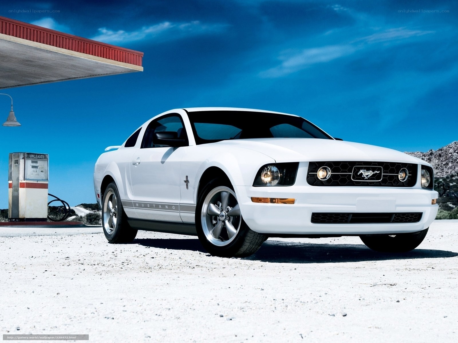White Ford Mustang at gas station