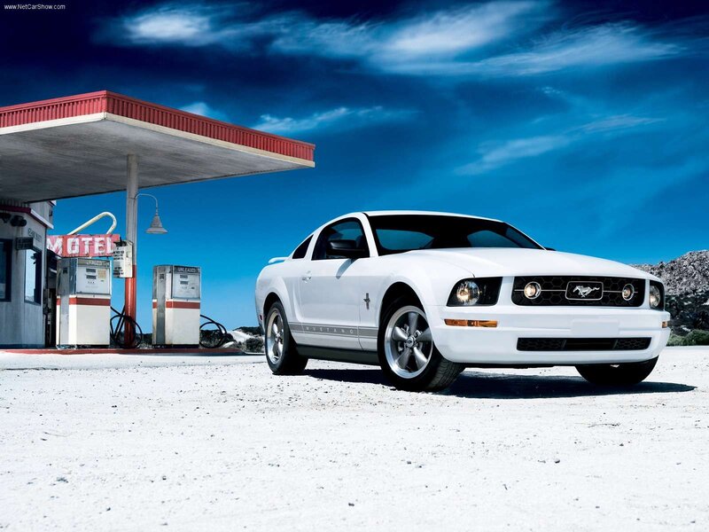 White Ford Mustang at gas station