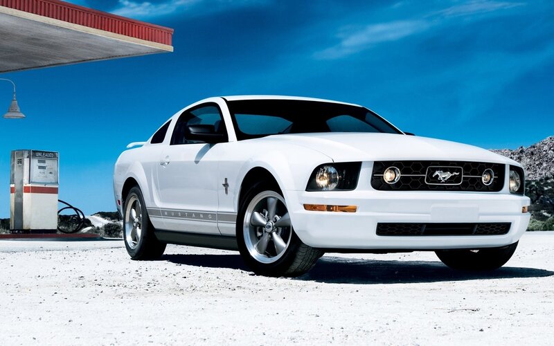 White Ford Mustang at gas station
