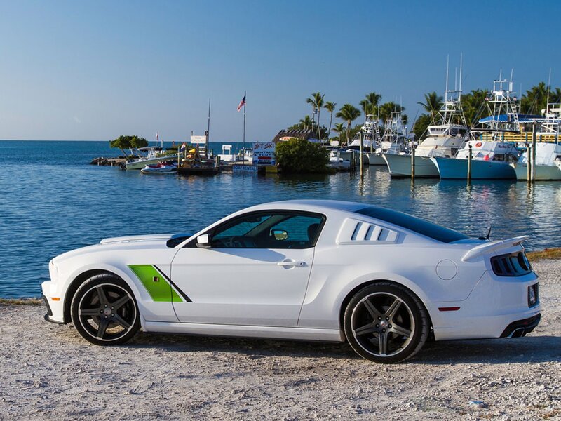 White Ford Mustang at marina