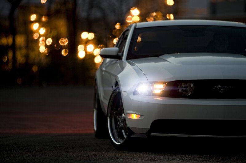White Ford Mustang at night