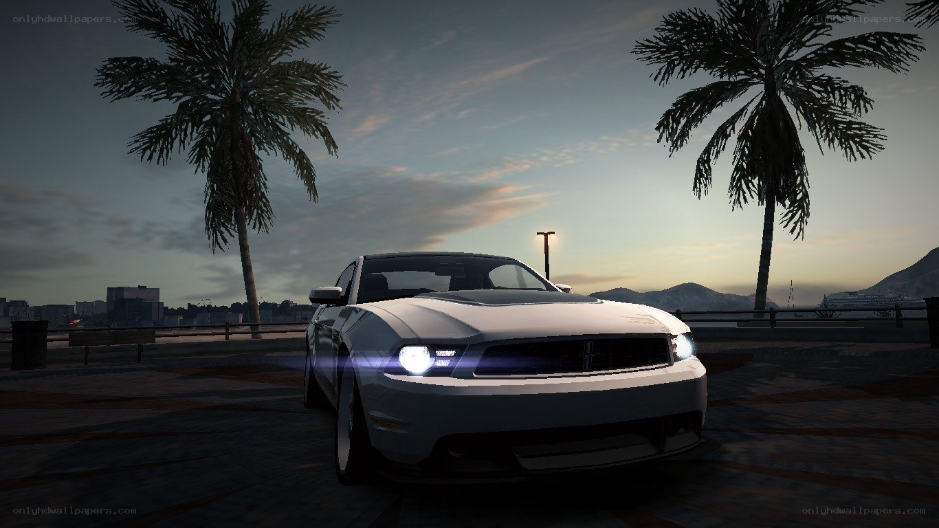 white ford mustang at sunset