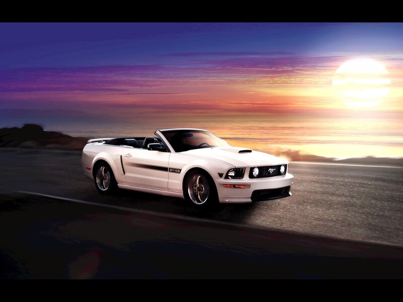 White Ford Mustang convertible at sunset