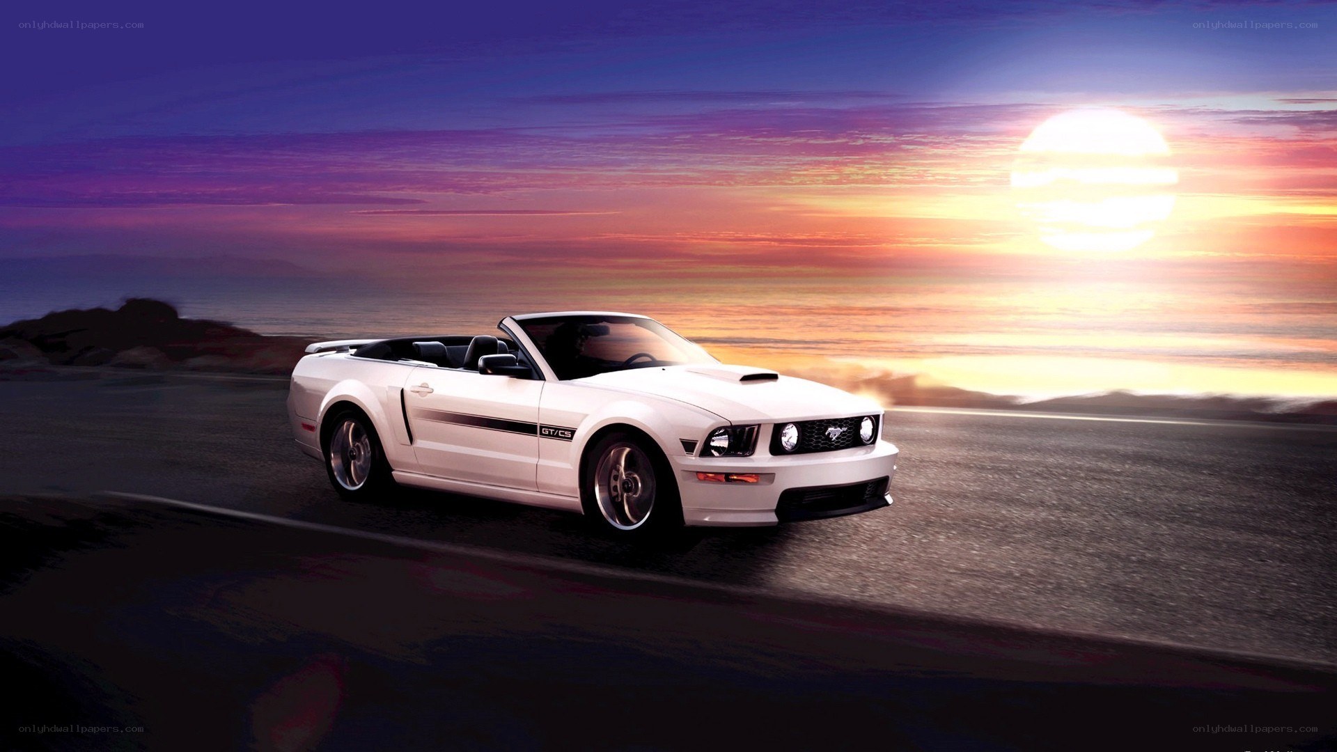 White Ford Mustang convertible at sunset