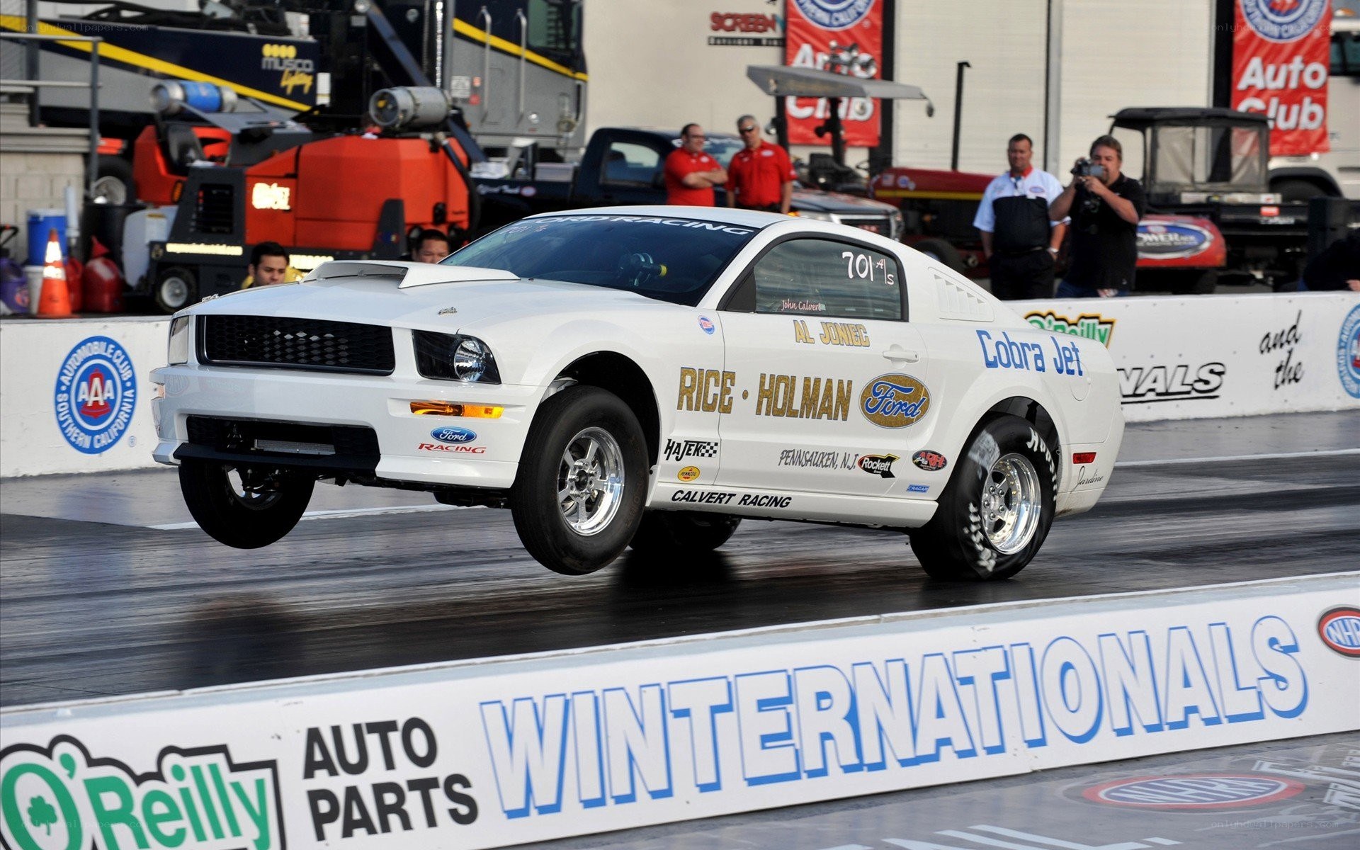 White Ford Mustang drag racing