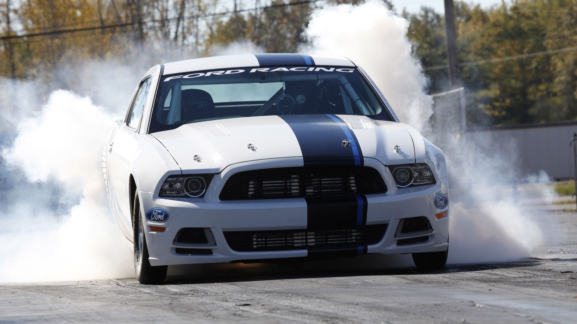 white ford mustang drifting