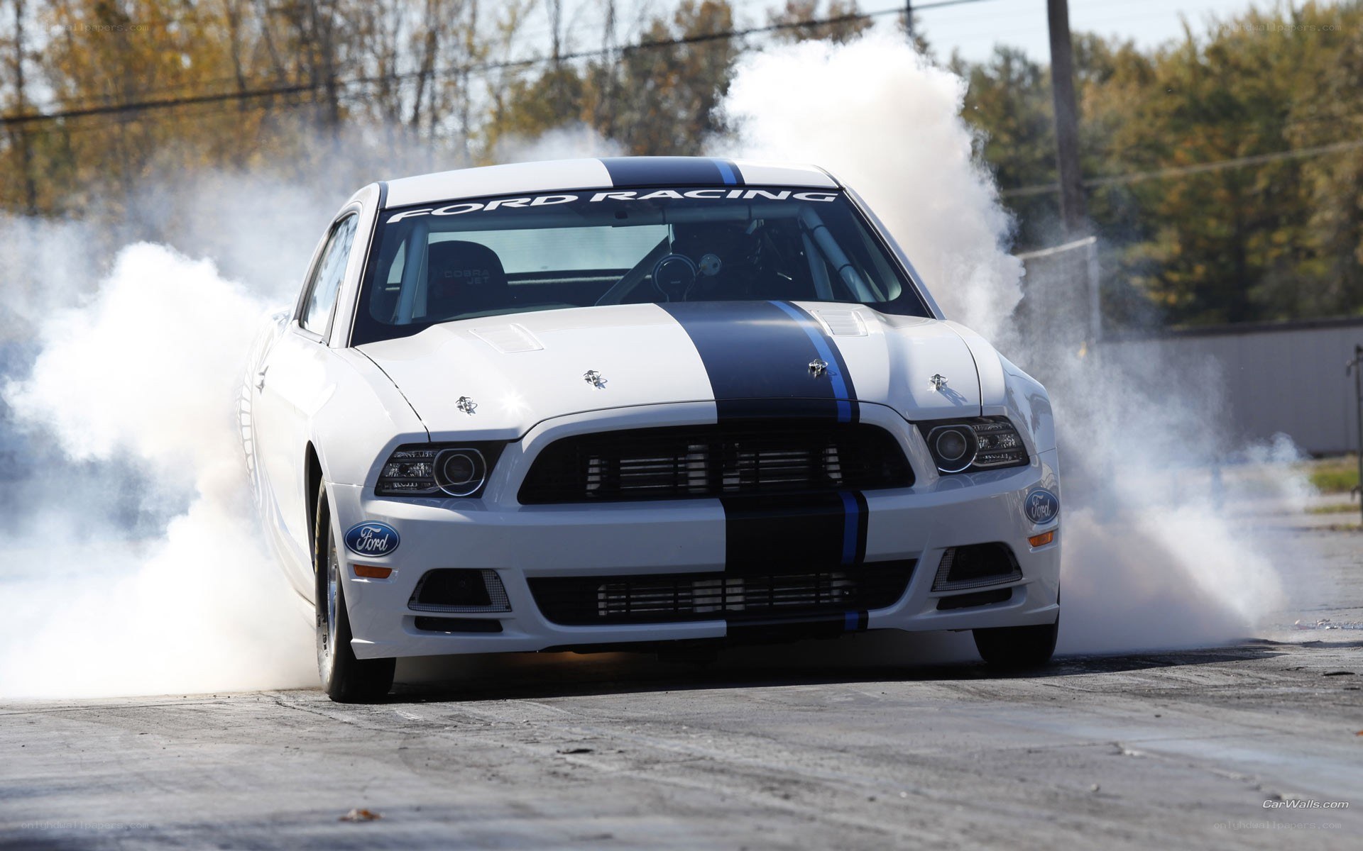 White Ford Mustang drifting