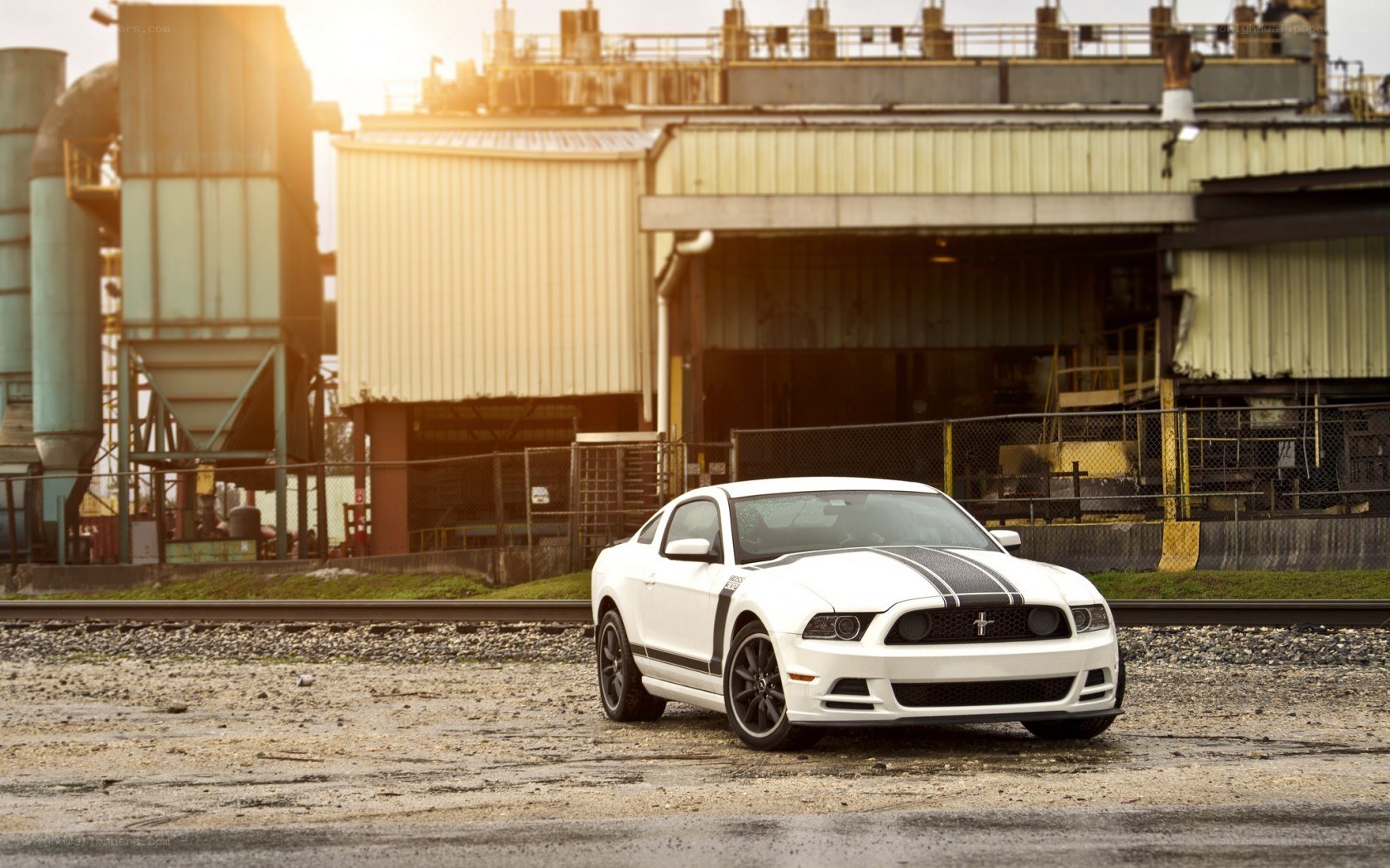 White Ford Mustang in industrial setting