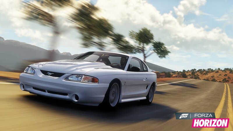 White Ford Mustang on a desert road