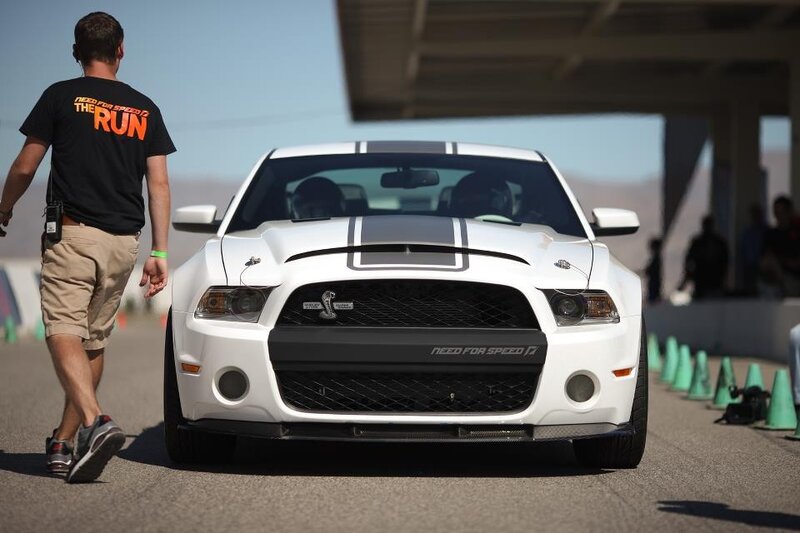 White Ford Mustang on a racetrack