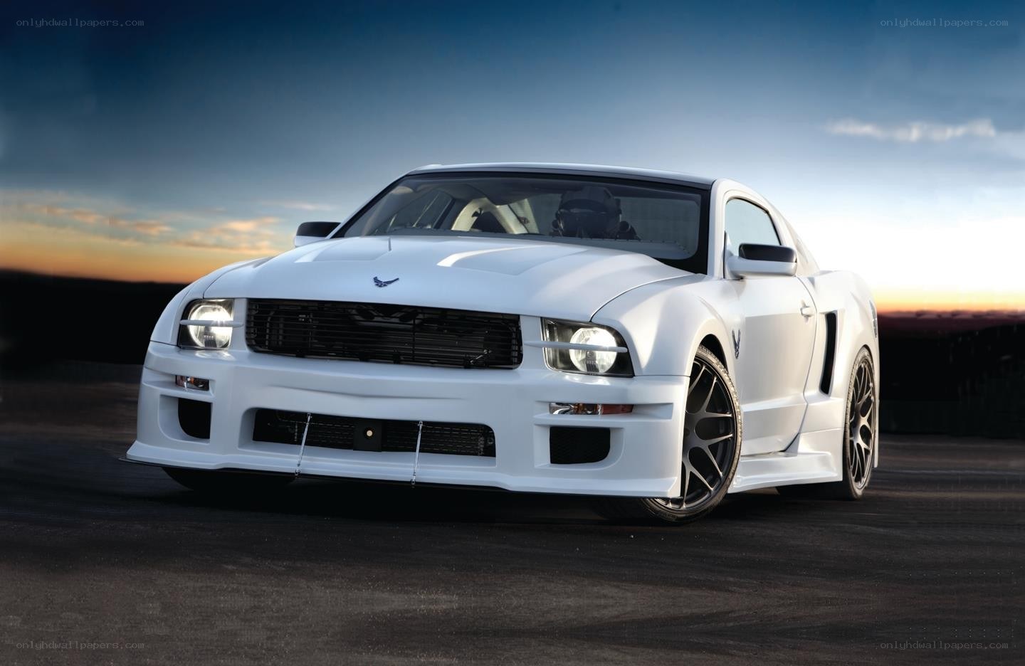 White Ford Mustang on a track