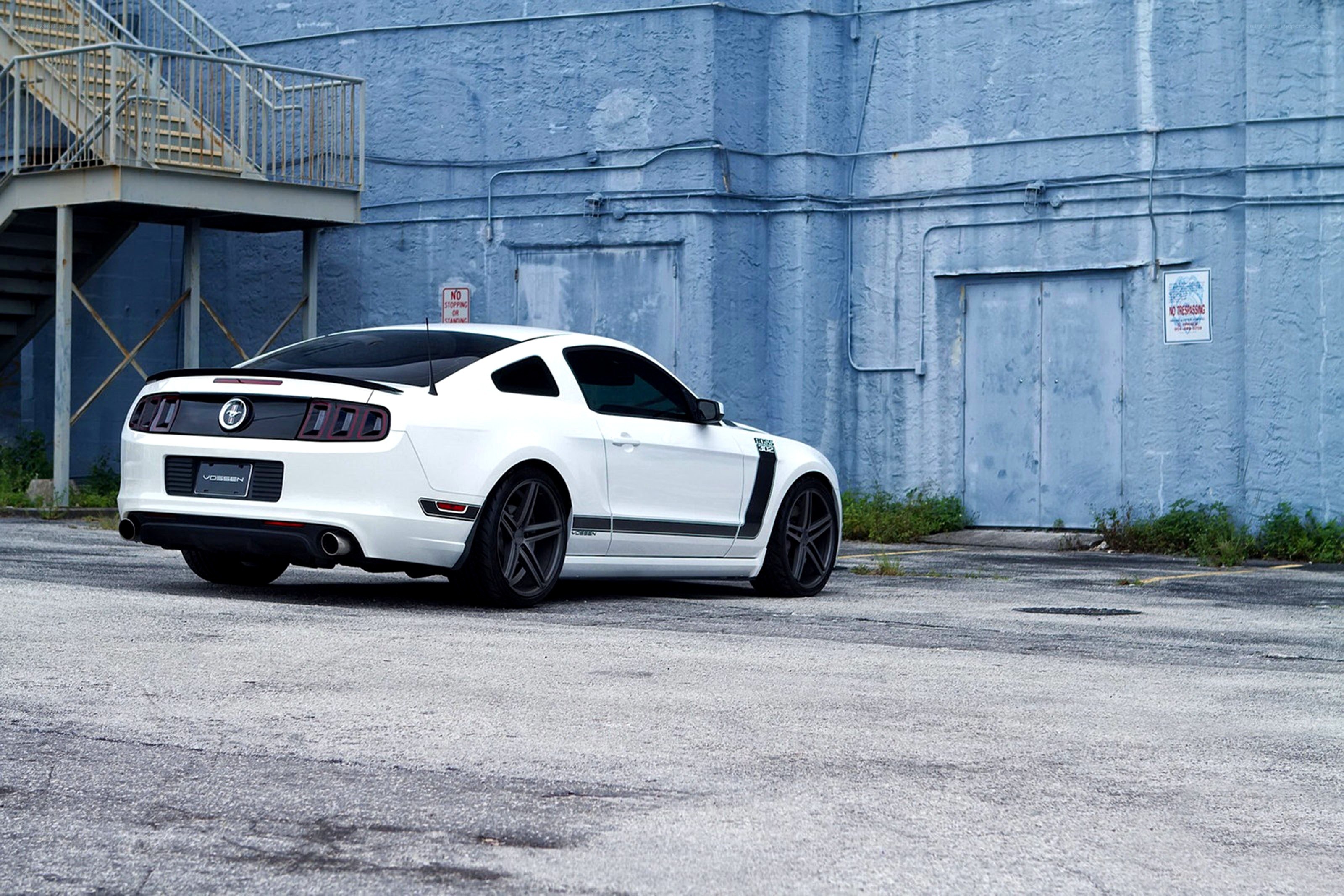 white ford mustang on asphalt