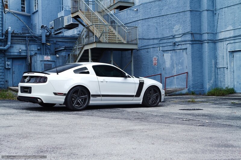 white ford mustang on street