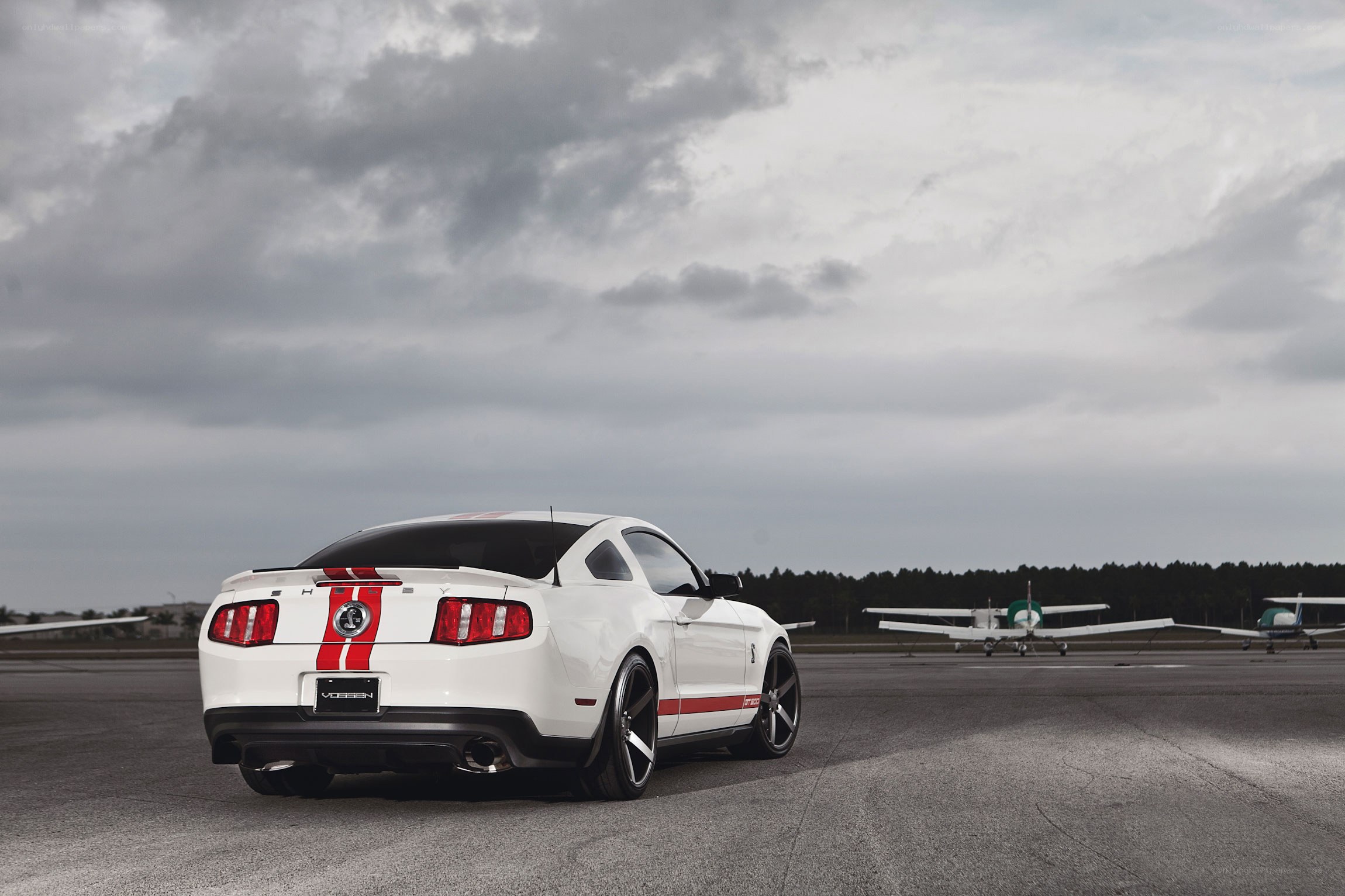 White Ford Mustang on tarmac