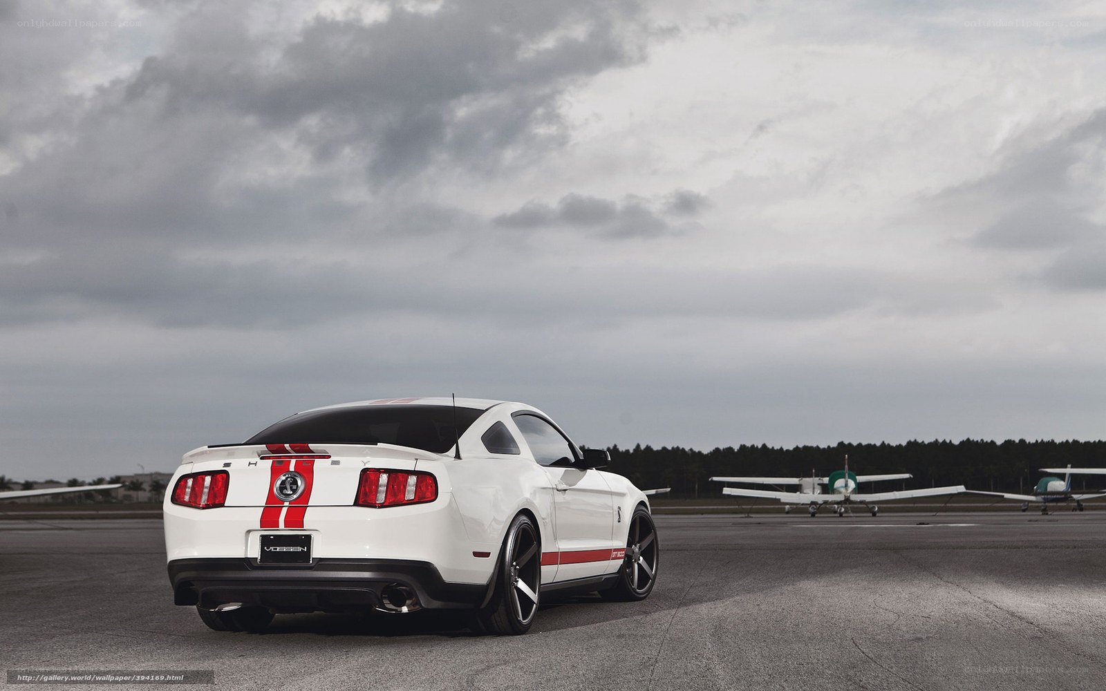 White Ford Mustang on tarmac