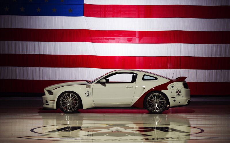 White Ford Mustang with American flag
